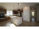 Modern kitchen features stainless steel appliances, a large island, and ample cabinet space at 28784 Rambutan Dr, Wesley Chapel, FL 33543