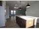 Kitchen island and open floorplan create inviting atmosphere with a view to the living space at 28784 Rambutan Dr, Wesley Chapel, FL 33543