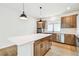 Modern kitchen with an island, stainless appliances, and ample cabinet space at 28784 Rambutan Dr, Wesley Chapel, FL 33543