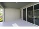 A covered patio with sliding glass doors offers a seamless transition to the outdoors at 28784 Rambutan Dr, Wesley Chapel, FL 33543