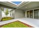 Covered patio featuring a neutral color scheme with mulch and small garden surrounding the open space at 28784 Rambutan Dr, Wesley Chapel, FL 33543