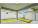 Covered patio with view of backyard, featuring concrete flooring and neutral tones at 28784 Rambutan Dr, Wesley Chapel, FL 33543