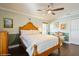 Bedroom with hard wood floors, neutral walls, ceiling fan, closet and traditional furniture at 3053 Glenwood Ct, Safety Harbor, FL 34695