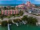 Beautiful coastal property featuring iconic pink architecture and scenic waterfront views at 3390 W Maritana Dr # 4, St Pete Beach, FL 33706