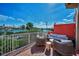 Relaxing balcony featuring comfortable seating and picturesque waterfront views at 3390 W Maritana Dr # 4, St Pete Beach, FL 33706