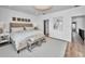 Spacious bedroom with neutral tones, hardwood floors, and a comfortable king-size bed at 3390 W Maritana Dr # 4, St Pete Beach, FL 33706