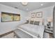 Inviting bedroom with a neutral color scheme and artistic decor, creating a relaxing atmosphere at 3390 W Maritana Dr # 4, St Pete Beach, FL 33706