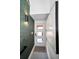 Chic entryway features a modern light fixture, decorative wallpaper, and art piece at 3390 W Maritana Dr # 4, St Pete Beach, FL 33706