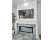 Modern fireplace featuring a zebra art piece and a unique, marbled hearth and flooring at 3390 W Maritana Dr # 4, St Pete Beach, FL 33706