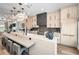 Spacious kitchen with a large island featuring seating, modern appliances, and stylish cabinetry at 3390 W Maritana Dr # 4, St Pete Beach, FL 33706