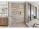 Luxury bathroom with tiled shower, and glass door with a balcony offering city views at 5120 Marina Way # 15006, Tampa, FL 33611