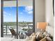 Bedroom featuring a balcony with outdoor seating and cityscape views at 5120 Marina Way # 15006, Tampa, FL 33611