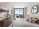 Bedroom with city view featuring a large bed, modern decor, and balcony access at 5120 Marina Way # 15006, Tampa, FL 33611