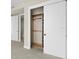 Bedroom closet with sliding doors and custom shelving at 5120 Marina Way # 15006, Tampa, FL 33611