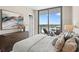 Comfortable main bedroom features balcony access to city views and warm natural light at 5120 Marina Way # 15006, Tampa, FL 33611