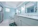 Bathroom features double sinks, marble countertops, and a glass-enclosed shower at 5130 Brittany S Dr # 201, St Petersburg, FL 33715