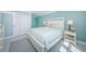 This bedroom offers a relaxing space with water view and coastal colors at 5130 Brittany S Dr # 201, St Petersburg, FL 33715