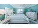 Bedroom featuring comfortable furnishings and a picturesque water view at 5130 Brittany S Dr # 201, St Petersburg, FL 33715