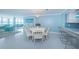 Bright dining room featuring a chandelier, coastal decor, and water views at 5130 Brittany S Dr # 201, St Petersburg, FL 33715