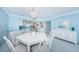 Dining room featuring an open kitchen, modern decor, and adjacent countertop seating at 5130 Brittany S Dr # 201, St Petersburg, FL 33715