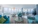 Open-concept living area with waterfront views, stylish seating, and ample natural light at 5130 Brittany S Dr # 201, St Petersburg, FL 33715