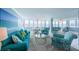 Spacious living room with water views, modern furnishings, and an open layout at 5130 Brittany S Dr # 201, St Petersburg, FL 33715