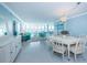 Bright living room with water views, modern furniture, and tile floors at 5130 Brittany S Dr # 201, St Petersburg, FL 33715