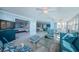 Bright living room featuring water views, comfortable seating, and an open floor plan at 5130 Brittany S Dr # 201, St Petersburg, FL 33715