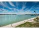 Beautiful panoramic water view showcasing a clear blue sky, calm waters, and waterfront community at 5130 Brittany S Dr # 201, St Petersburg, FL 33715