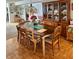 Traditional dining room with a wooden table, chairs, and china cabinet, perfect for Gathering gatherings at 5980 Shore S Blvd # 510, Gulfport, FL 33707