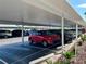 Covered parking area with multiple vehicles, offering shade and protection at 5980 Shore S Blvd # 510, Gulfport, FL 33707