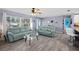 Spacious living room featuring sofas and a large window at 9911 Antilles Dr, Seminole, FL 33776