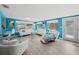Bright living room featuring modern furniture, tile flooring, and large windows for ample natural light at 9911 Antilles Dr, Seminole, FL 33776