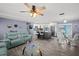 Inviting living room open to the kitchen and dining area, perfect for entertaining at 9911 Antilles Dr, Seminole, FL 33776