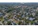 Aerial view pinpoints property amidst lush neighborhood near a distant waterfront at 1213 60Th S St, Gulfport, FL 33707