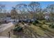 Aerial view of a charming single-story home featuring a well-maintained lawn and mature trees at , Gulfport, FL 33707