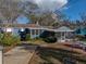 The backyard has a concrete driveway and a screened in porch at 1213 60Th S St, Gulfport, FL 33707