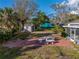 Well-maintained backyard with patio area, storage shed, and mature trees at , Gulfport, FL 33707