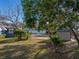 Spacious backyard with a shed, established landscaping, and outdoor seating area at 1213 60Th S St, Gulfport, FL 33707