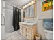 This bright bathroom includes a shower and modern sink at 1213 60Th S St, Gulfport, FL 33707