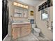 Cozy bathroom featuring neutral tones, light fixtures, and a large vanity at 1213 60Th S St, Gulfport, FL 33707
