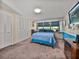Comfortable bedroom with a window that brings in natural light, a closet and cozy carpet at 1213 60Th S St, Gulfport, FL 33707