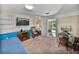 This bedroom features a desk, closet, wainscoting, and plenty of space at 1213 60Th S St, Gulfport, FL 33707