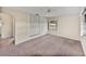 Simple bedroom with a ceiling fan, a window, and closet with built-in drawers at 1213 60Th S St, Gulfport, FL 33707