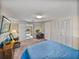 This bedroom has a desk, rocking chair, closet, and sliding doors at 1213 60Th S St, Gulfport, FL 33707