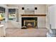 Classic fireplace with a wooden mantle in a cozy living room at 1213 60Th S St, Gulfport, FL 33707