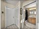 Hallway view to a full bathroom featuring neutral tiling at 1213 60Th S St, Gulfport, FL 33707