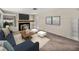 Bright living room featuring a fireplace, neutral walls, and a large window at 1213 60Th S St, Gulfport, FL 33707