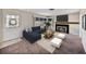 Cozy living room with a fireplace, a large window, and comfortable seating area at 1213 60Th S St, Gulfport, FL 33707