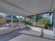 Screened-in patio featuring tiled flooring and a view of outdoor seating at 1213 60Th S St, Gulfport, FL 33707